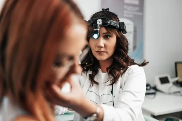 Audiology doctor examining patient in Lely & East Naples