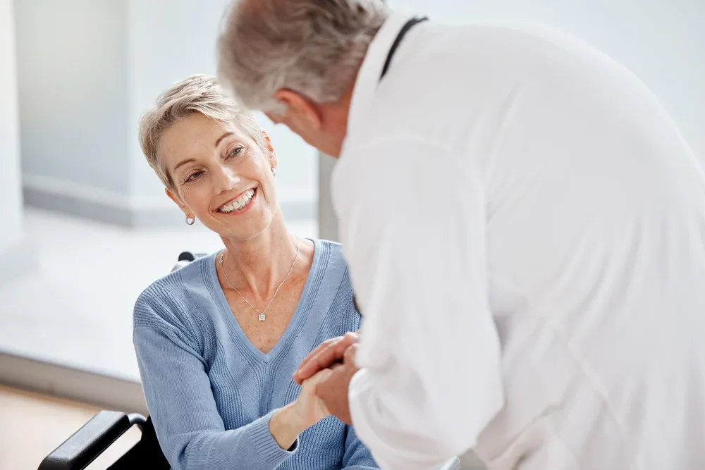 Audiologist meeting with patient who is suffering from deafness and hearing loss